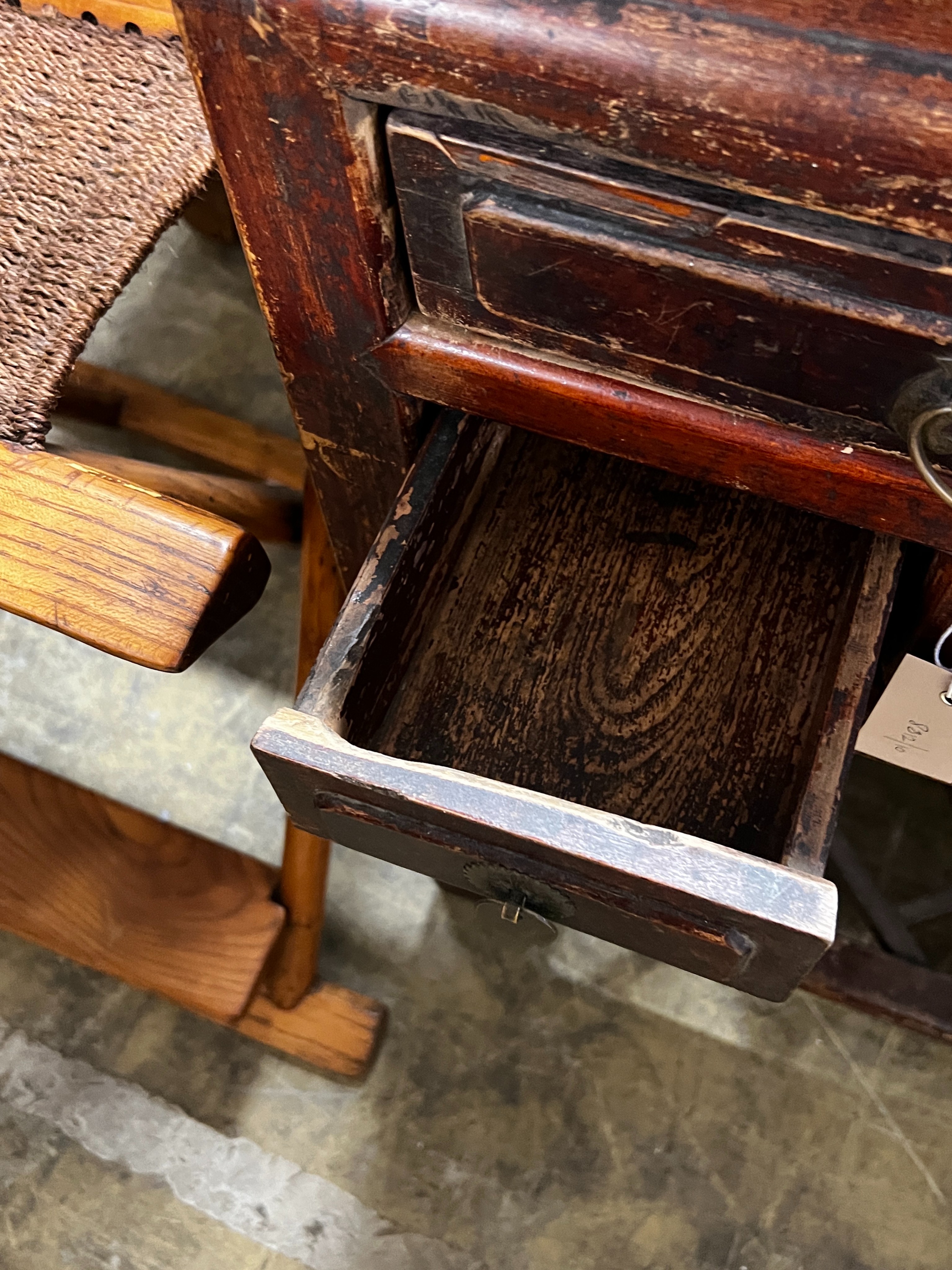 A Chinese lacquered wood three drawer side table, width 43cm, depth 44cm, height 77cm